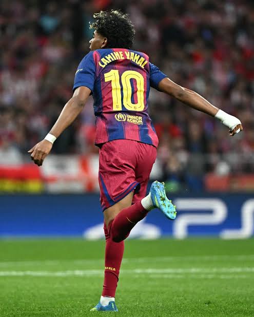 Lamine Yamal celebrating a goal for FC Barcelona while wearing the new number 10 shirt