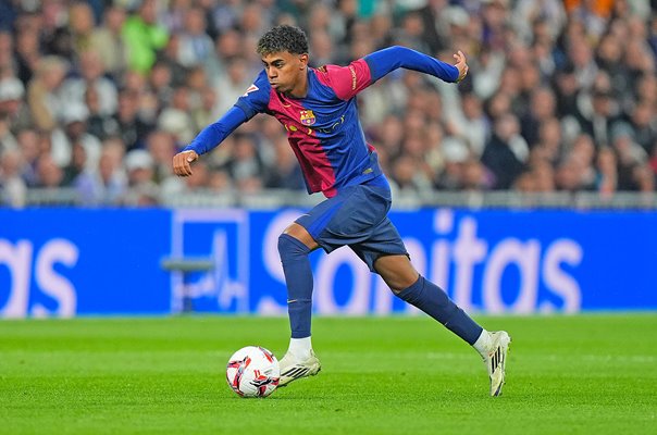 Lamine Yamal, FC Barcelona's No. 10, dribbling past defenders during a La Liga match